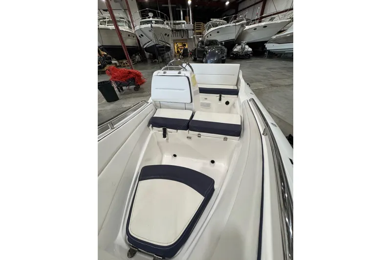 Slide: The Image of 2018 AB Inflatables Nautilus 12 DLX boat interior with cushioned seating in a showroom. - 10