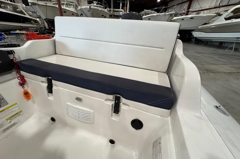 Slide: The Image of 2018 AB Inflatables Nautilus 12 DLX boat interior with cushioned seating in a showroom. - 11