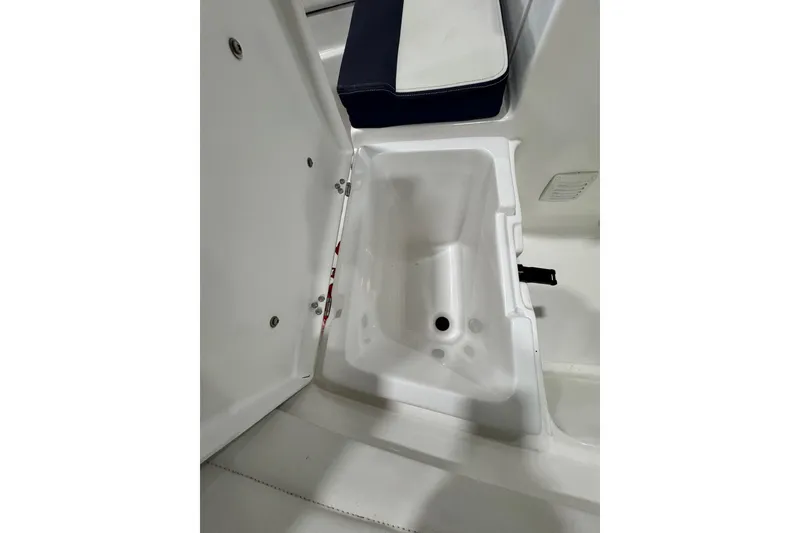 Slide: The Image of 2018 AB Inflatables Nautilus 12 DLX storage compartment with open lid and seating area. - 17