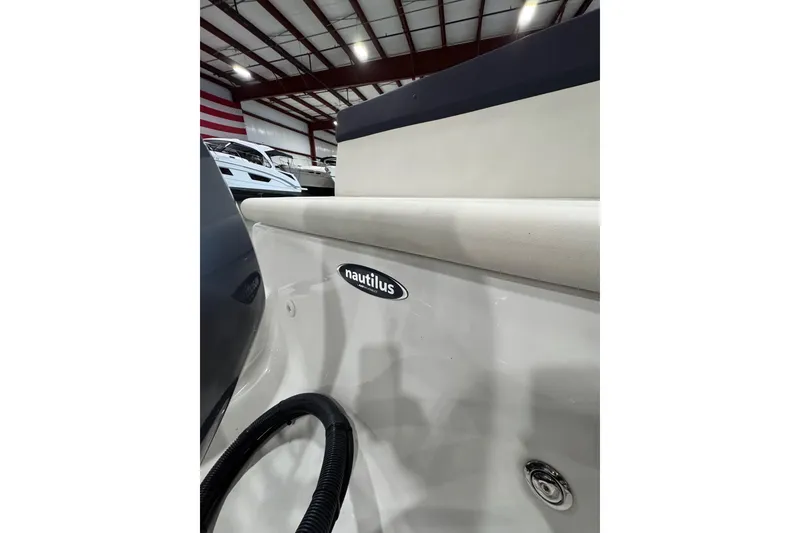Slide: The Image of 2018 AB Inflatables Nautilus 12 DLX boat interior with logo in a showroom. - 20