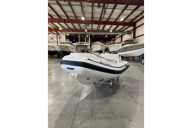 Slide: The Image of 2018 AB Inflatables Nautilus 12 DLX boat in a showroom with other vessels. - 3