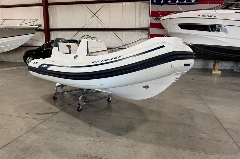 Slide: The Image of 2018 AB Inflatables Nautilus 12 DLX boat displayed indoors on a wheeled stand. - 4