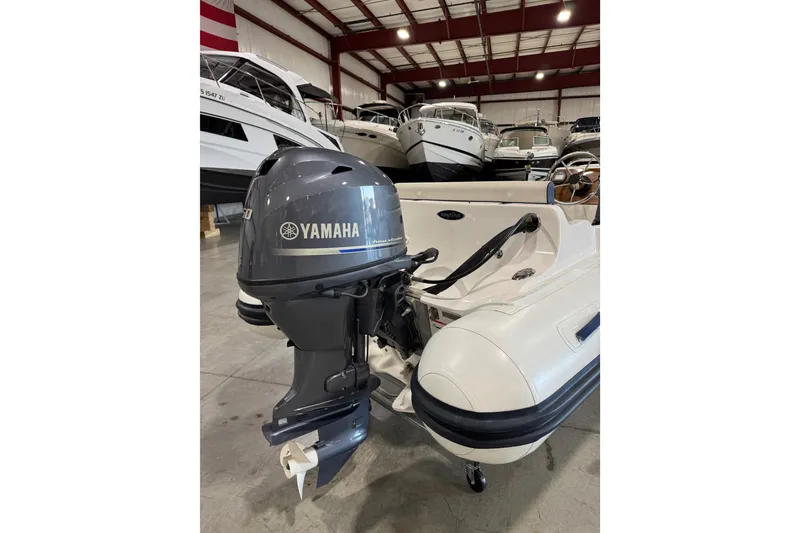Slide: The Image of 2018 AB Inflatables Nautilus 12 DLX with Yamaha outboard in a boat showroom. - 5