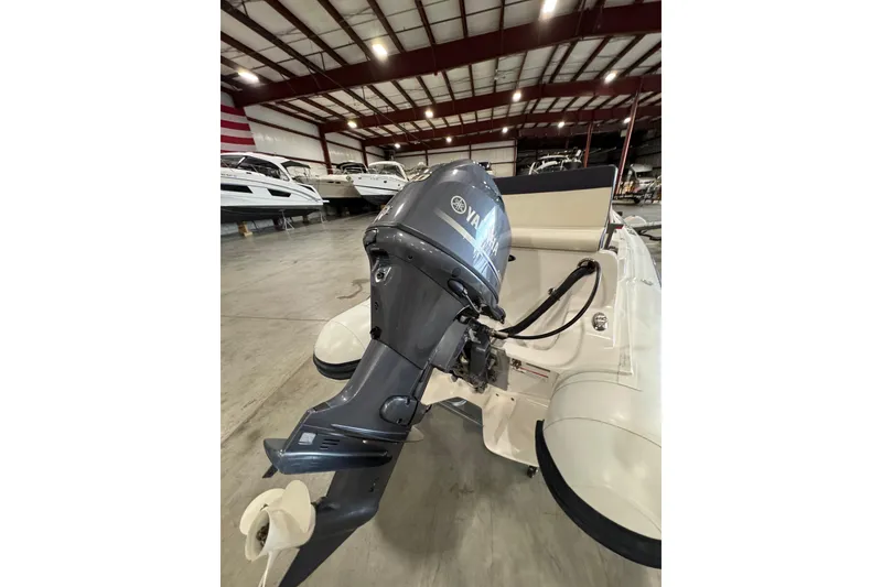 Slide: The Image of 2018 AB Inflatables Nautilus 12 DLX with Yamaha outboard motor in a showroom. - 9