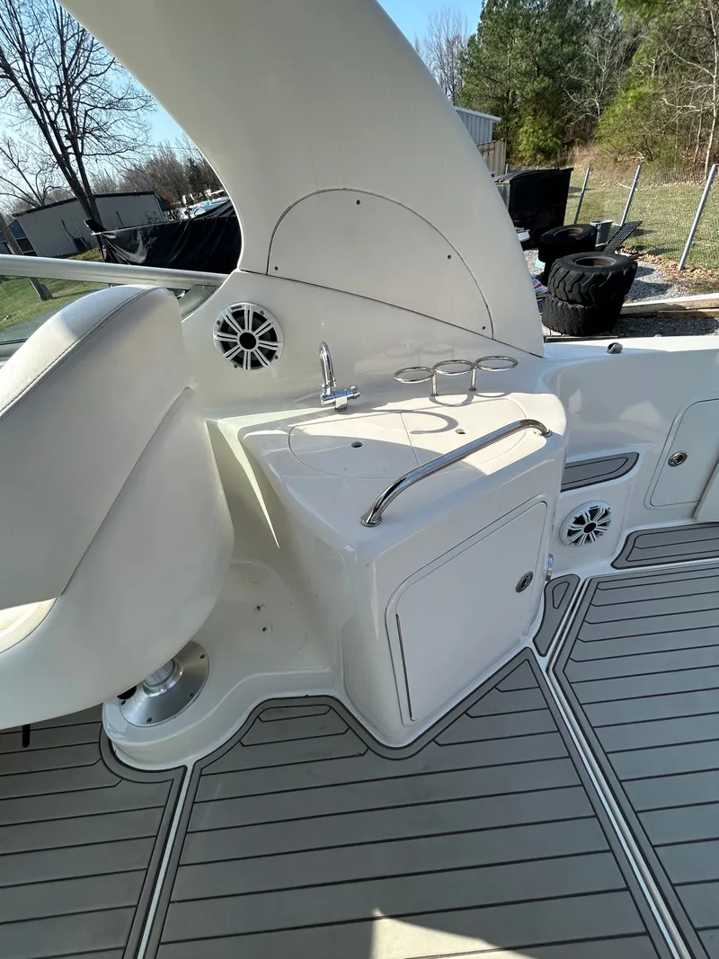 Slide: The Image of Interior of a 2005 Sea Ray Sundancer 280 with sink and speakers. - 17
