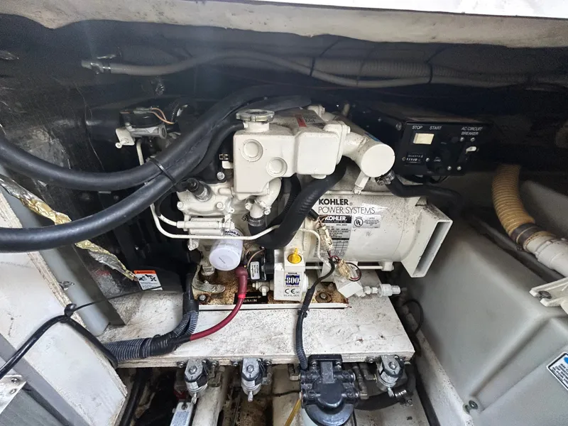 Slide: The Image of Kohler generator in the engine compartment of a 2005 Sea Ray Sundancer 280. - 23