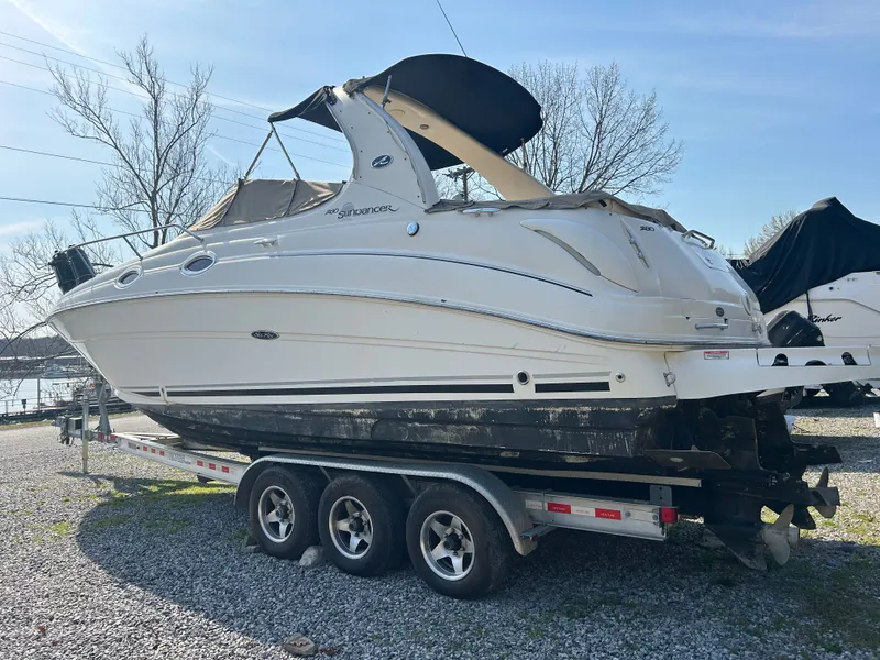 Slide: The Image of 2005 Sea Ray Sundancer 280 on trailer outdoors. - 25