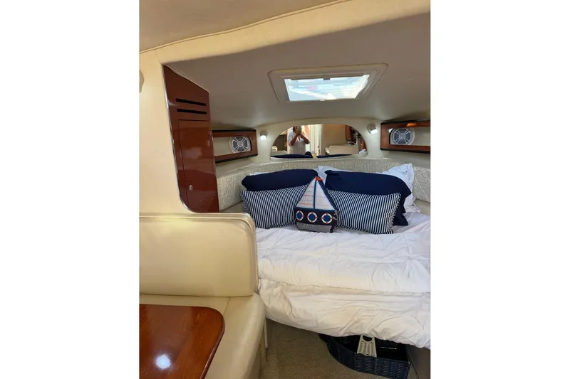 Slide: The Image of Interior cabin of 2005 Sea Ray Sundancer 280 with cozy bedding and nautical decor. - 31