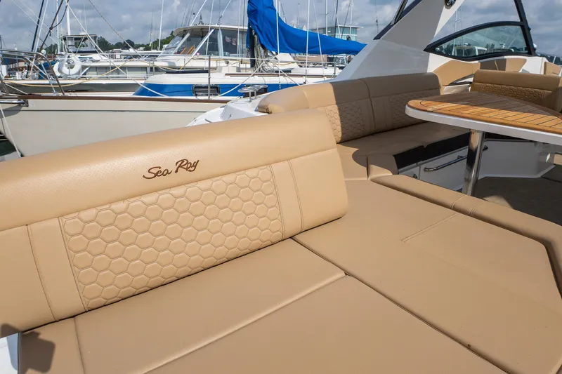 Slide: The Image of Luxurious seating on 2019 Sea Ray Sundancer 320 yacht, featuring elegant tan upholstery. - 12