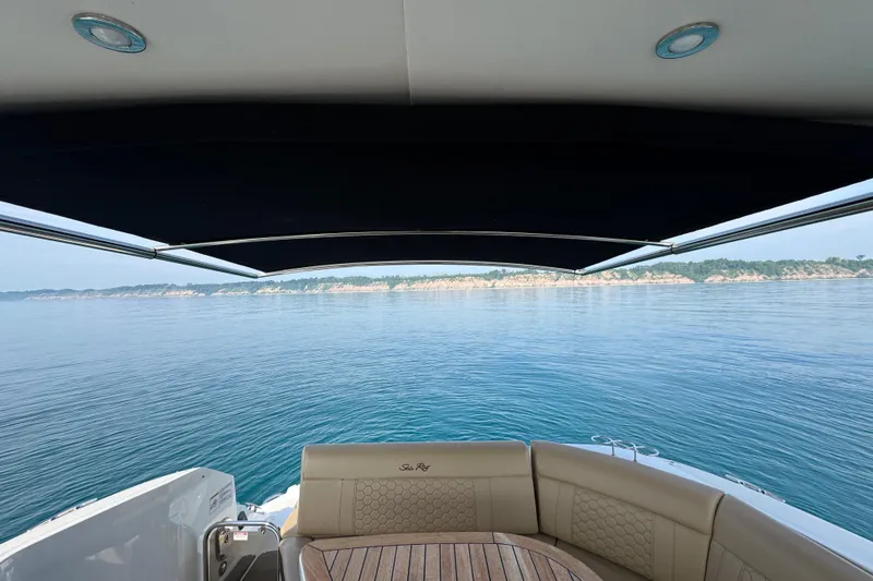 Slide: The Image of 2019 Sea Ray Sundancer 320 yacht with scenic ocean view and comfortable seating. - 15