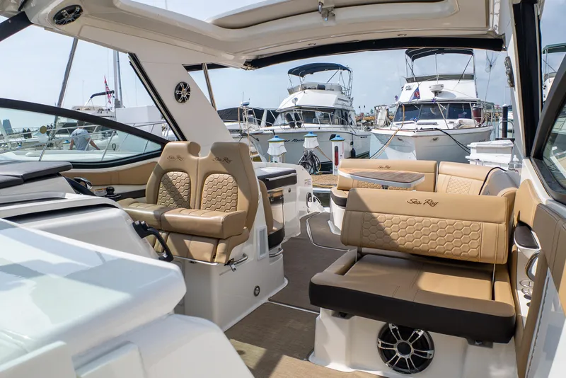 Slide: The Image of Luxurious 2019 Sea Ray Sundancer 320 yacht interior with elegant seating at marina. - 35