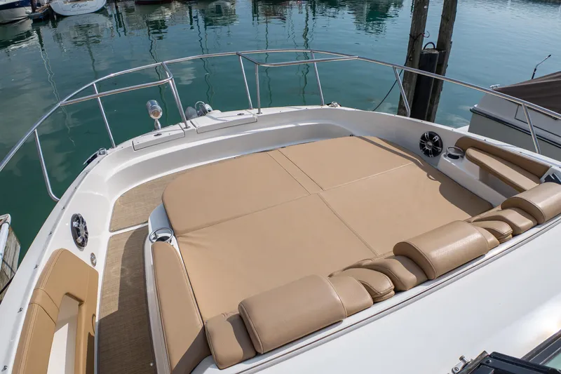 Slide: The Image of 2019 Sea Ray Sundancer 320 boat with spacious sunbathing deck at marina. - 39
