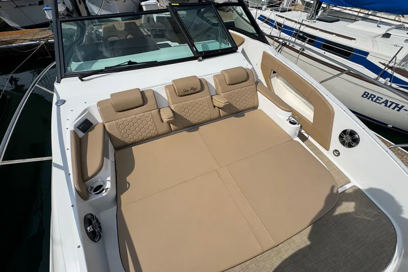 Slide: The Image of 2019 Sea Ray Sundancer 320 boat with spacious tan seating and modern design. - 43
