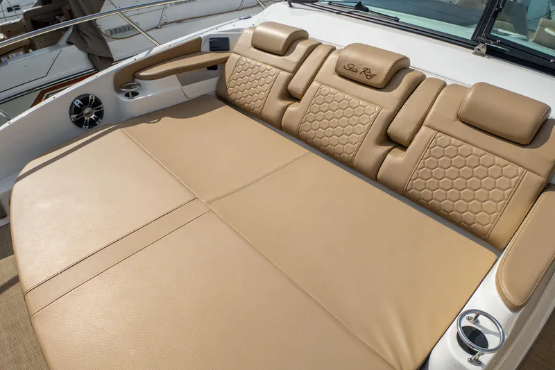 Slide: The Image of Luxurious tan seating on 2019 Sea Ray Sundancer 320 yacht, featuring hexagonal patterns. - 44