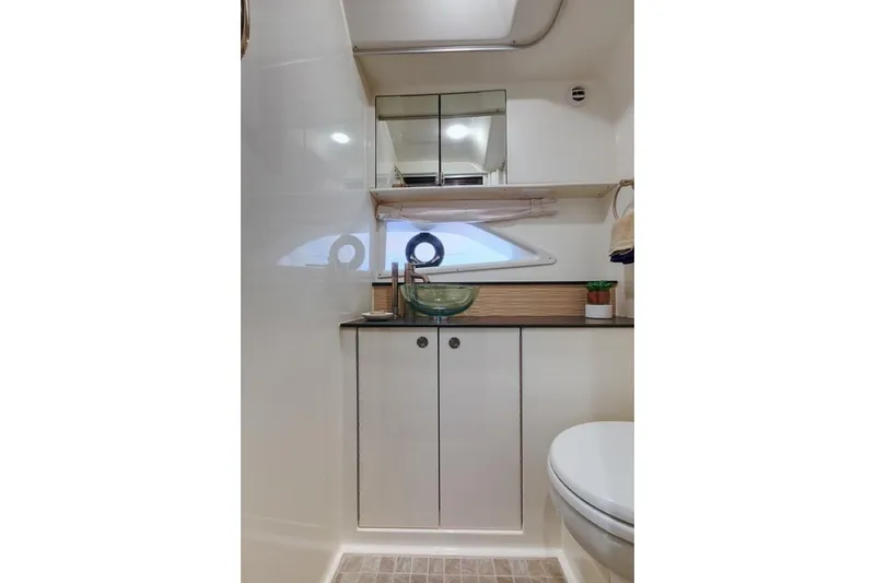 Slide: The Image of Manufacturer Provided Image: 2019 Sea Ray Sundancer 320 bathroom with modern fixtures and ample storage. - 54
