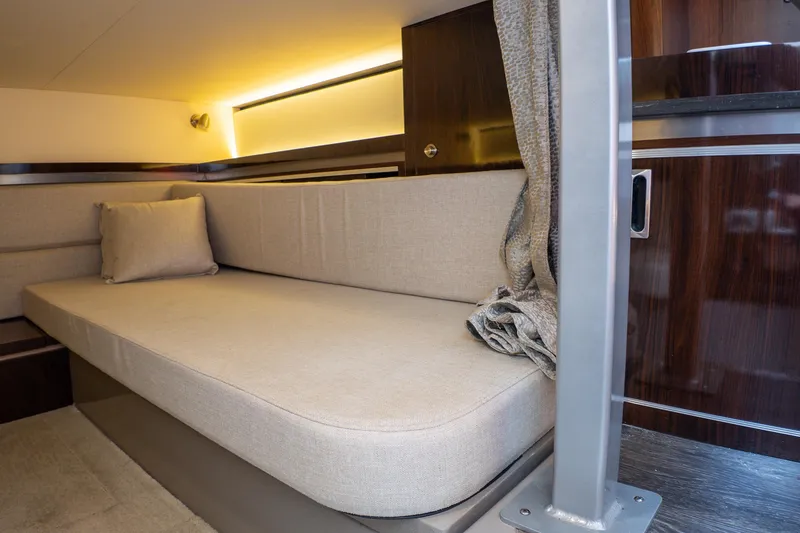 Slide: The Image of Interior cabin of 2019 Sea Ray Sundancer 320 with beige seating and ambient lighting. - 57