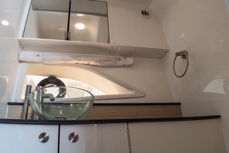 Slide: The Image of 2019 Sea Ray Sundancer 320 bathroom with glass sink and modern fixtures. - 62
