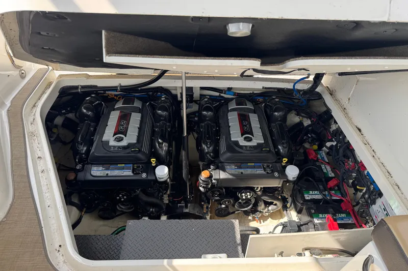 Slide: The Image of Engine compartment of a 2019 Sea Ray Sundancer 320 with twin 6.2L engines. - 65