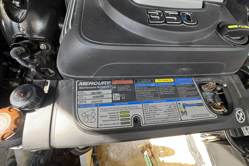 Slide: The Image of Engine compartment of a 2019 Sea Ray Sundancer 320 with Mercury maintenance schedule. - 67