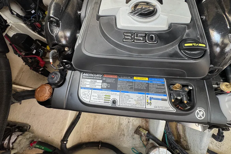 Slide: The Image of Engine compartment of a 2019 Sea Ray Sundancer 320 with Mercury 350 engine. - 68