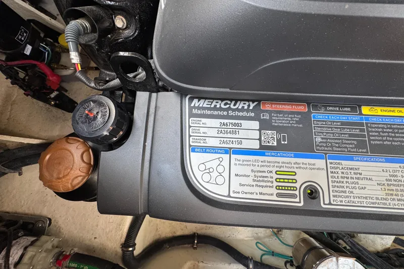Slide: The Image of Engine compartment of a 2019 Sea Ray Sundancer 320 with Mercury maintenance schedule. - 69