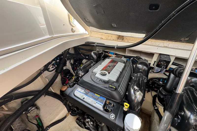 Slide: The Image of Engine compartment of a 2019 Sea Ray Sundancer 320 boat, showcasing a 6.2L engine. - 70