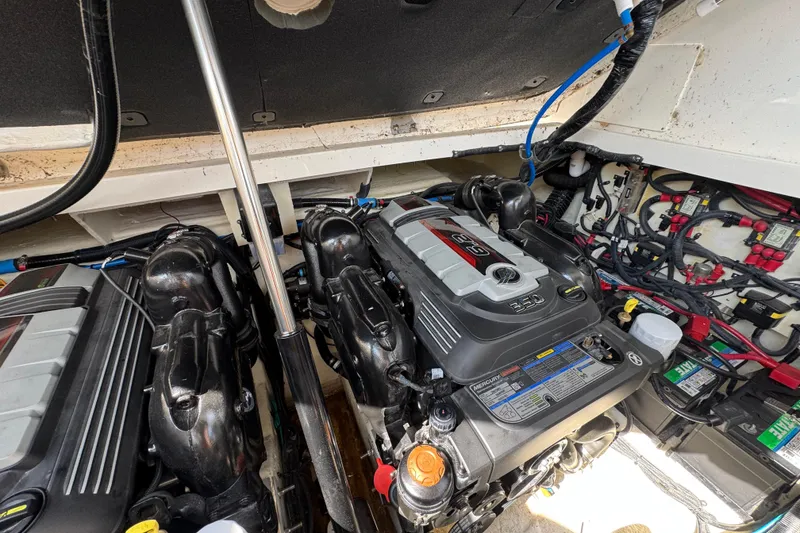 Slide: The Image of Engine compartment of a 2019 Sea Ray Sundancer 320 with dual Mercury engines. - 71