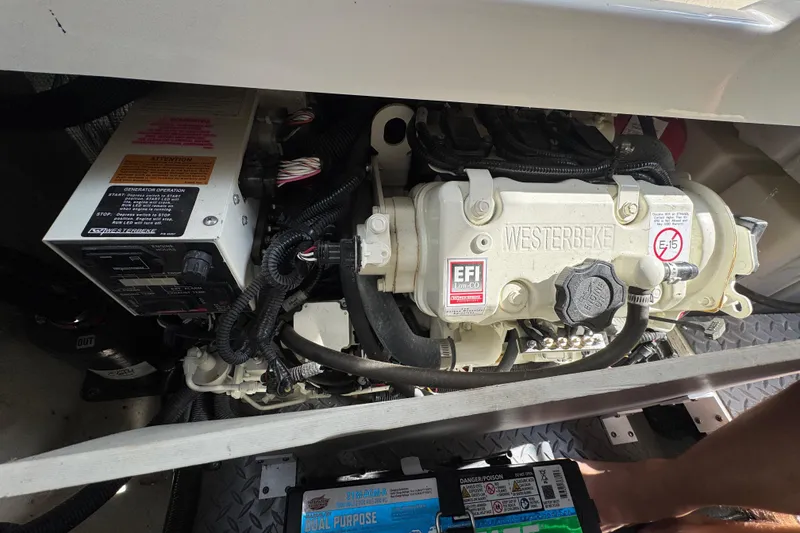 Slide: The Image of Engine compartment of 2019 Sea Ray Sundancer 320 with Westerbeke generator. - 73