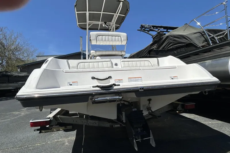 Slide: The Image of 2016 Yamaha Boats 190 FSH Sport on trailer, rear view, sunny day. - 10