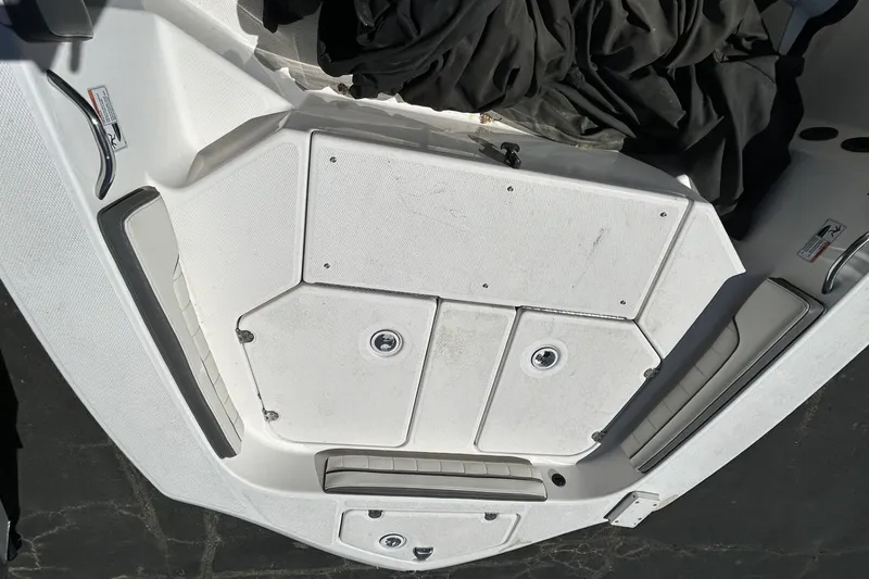 Slide: The Image of 2016 Yamaha Boats 190 FSH Sport deck with storage compartments and seating. - 7