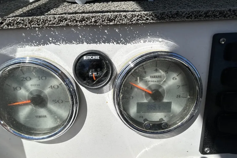 Slide: The Image of Dashboard of 2016 Yamaha Boats 190 FSH Sport with speedometer and compass. - 9