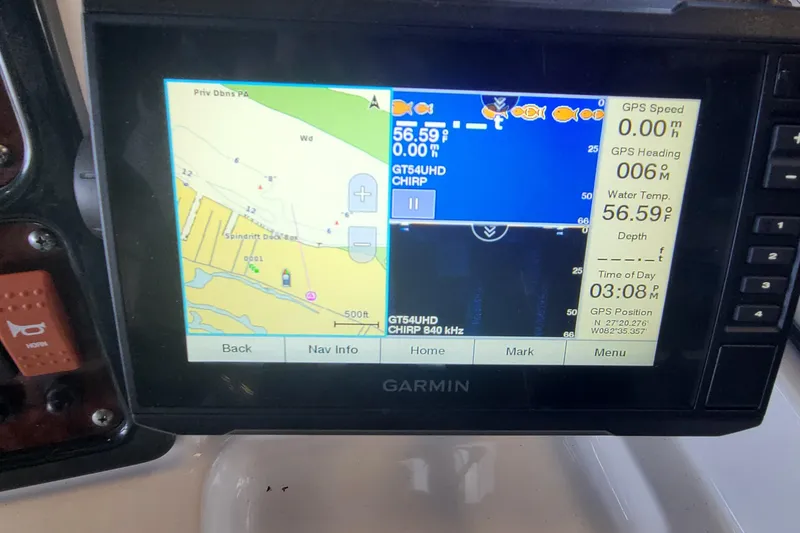 Slide: The Image of Garmin GPS display on 2013 Sea Hunt Escape 234 LE, showing navigation and water temperature. - 11