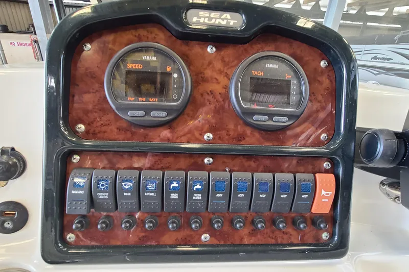 Slide: The Image of Control panel of 2013 Sea Hunt Escape 234 LE boat with Yamaha gauges and switches. - 12