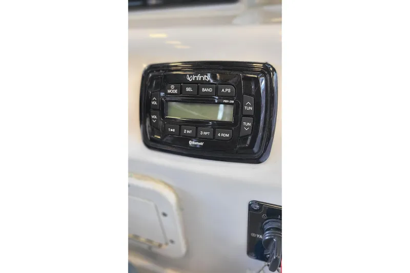 Slide: The Image of Infinity stereo system on 2013 Sea Hunt Escape 234 LE boat dashboard. - 14