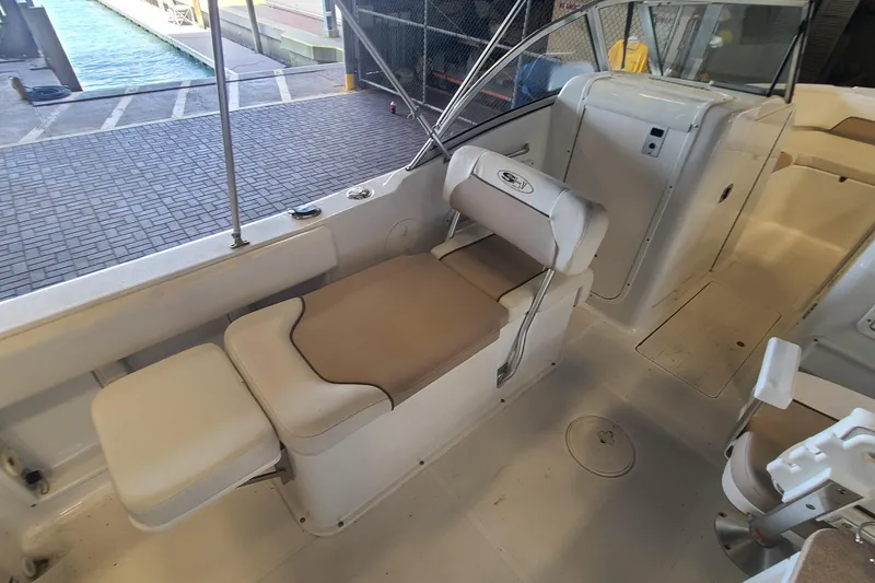 Slide: The Image of 2013 Sea Hunt Escape 234 LE boat interior with seating and helm area. - 16