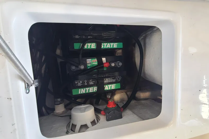 Slide: The Image of Battery compartment of 2013 Sea Hunt Escape 234 LE with Interstate batteries. - 27
