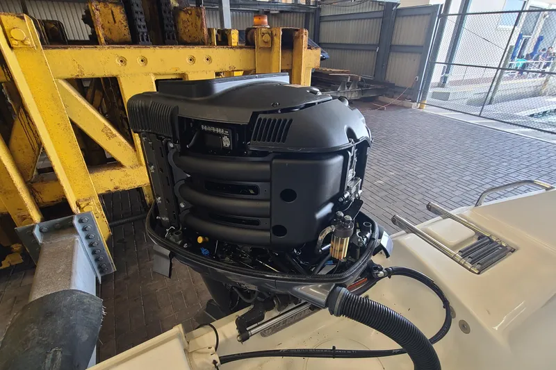 Slide: The Image of 2013 Sea Hunt Escape 234 LE boat engine in a workshop setting. - 30