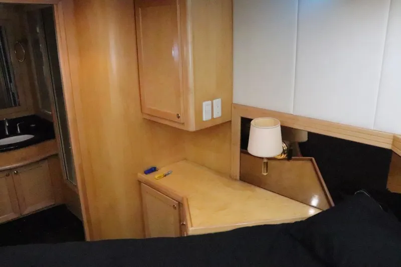 Slide: The Image of Luxurious interior of 2002 McKinna 57 Pilothouse yacht with wood cabinetry and modern amenities. - 24