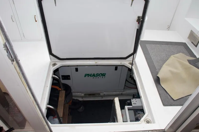 Slide: The Image of Engine compartment of 2002 McKinna 57 Pilothouse yacht with Phasor Marine generator. - 26