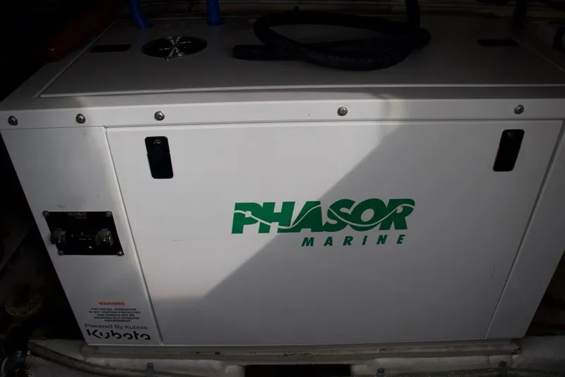 Slide: The Image of Phasor Marine generator in a 2002 McKinna 57 Pilothouse yacht engine room. - 29