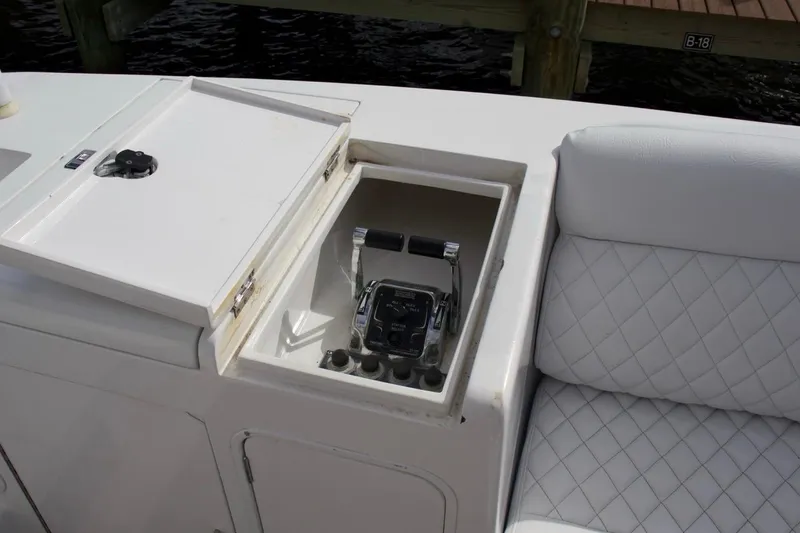 Slide: The Image of Control panel of a 2002 McKinna 57 Pilothouse yacht with cushioned seating. - 38