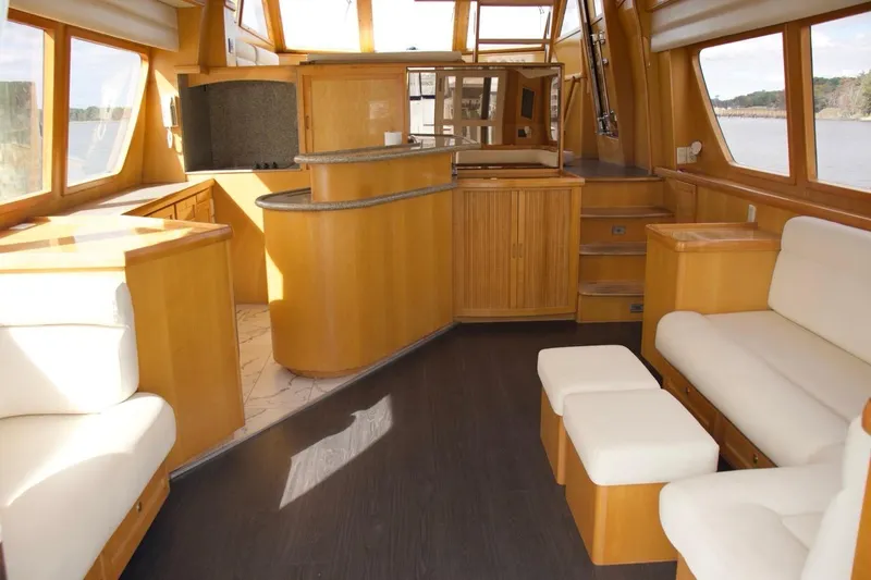 Slide: The Image of Luxurious interior of 2002 McKinna 57 Pilothouse yacht with elegant wood finishes. - 41