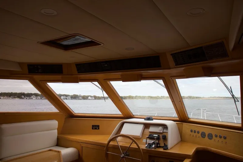Slide: The Image of Interior view of 2002 McKinna 57 Pilothouse yacht with panoramic windows. - 49
