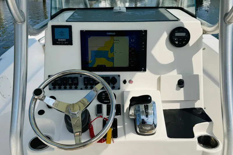 Slide: The Image of 2018 Sea Born LX24 Center Console dashboard with steering wheel and navigation display. - 6