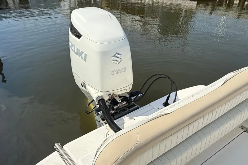 Slide: The Image of 2018 Sea Born LX24 Center Console with Suzuki 300 outboard motor on calm water. - 9