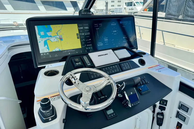 Slide: The Image of Helm of 2025 Intrepid 50 Evolution yacht with advanced navigation displays. - 15