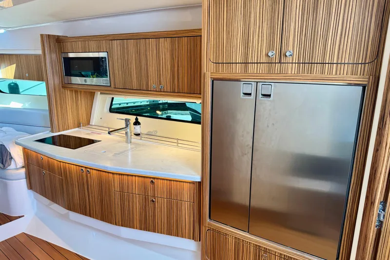Slide: The Image of Luxurious kitchen interior of 2025 Intrepid 50 Evolution yacht with modern appliances. - 33