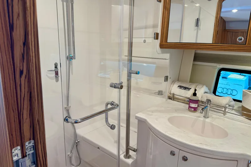 Slide: The Image of Luxurious bathroom in 2025 Intrepid 50 Evolution yacht with modern fixtures and elegant design. - 35