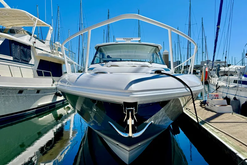 Slide: The Image of 2025 Intrepid 50 Evolution yacht docked at marina, surrounded by sailboats. - 39