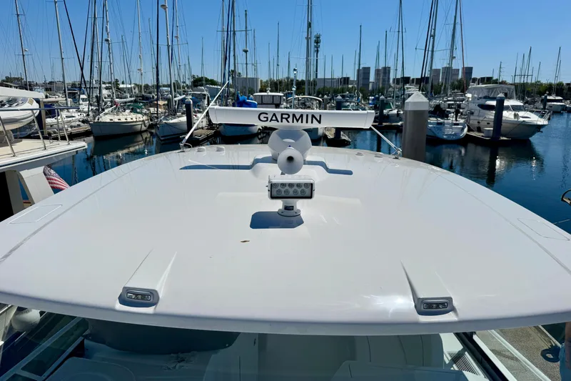Slide: The Image of 2025 Intrepid 50 Evolution yacht with Garmin radar at marina. - 40